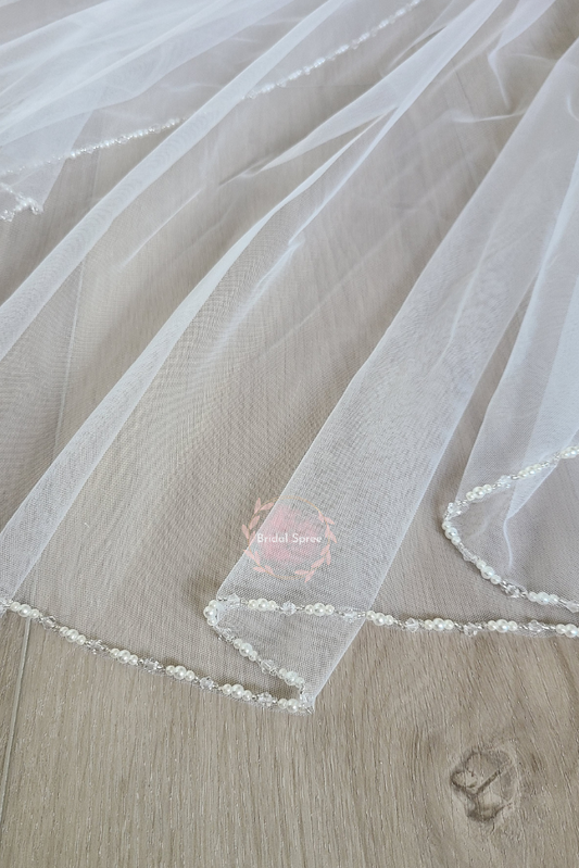 Beaded fingertip veil with crystals and pearls sold by Bridal Spree Canada USA