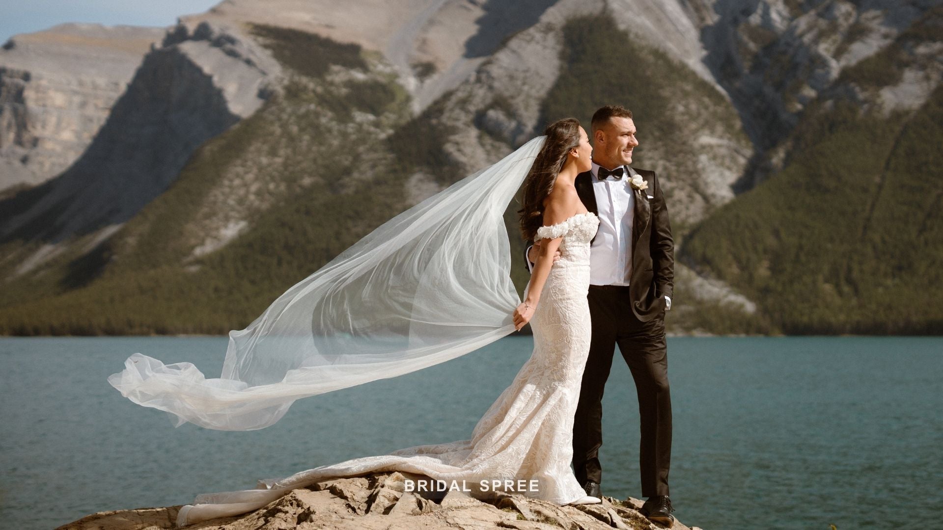 bride wearing cathedral length veil for outdoor wedding