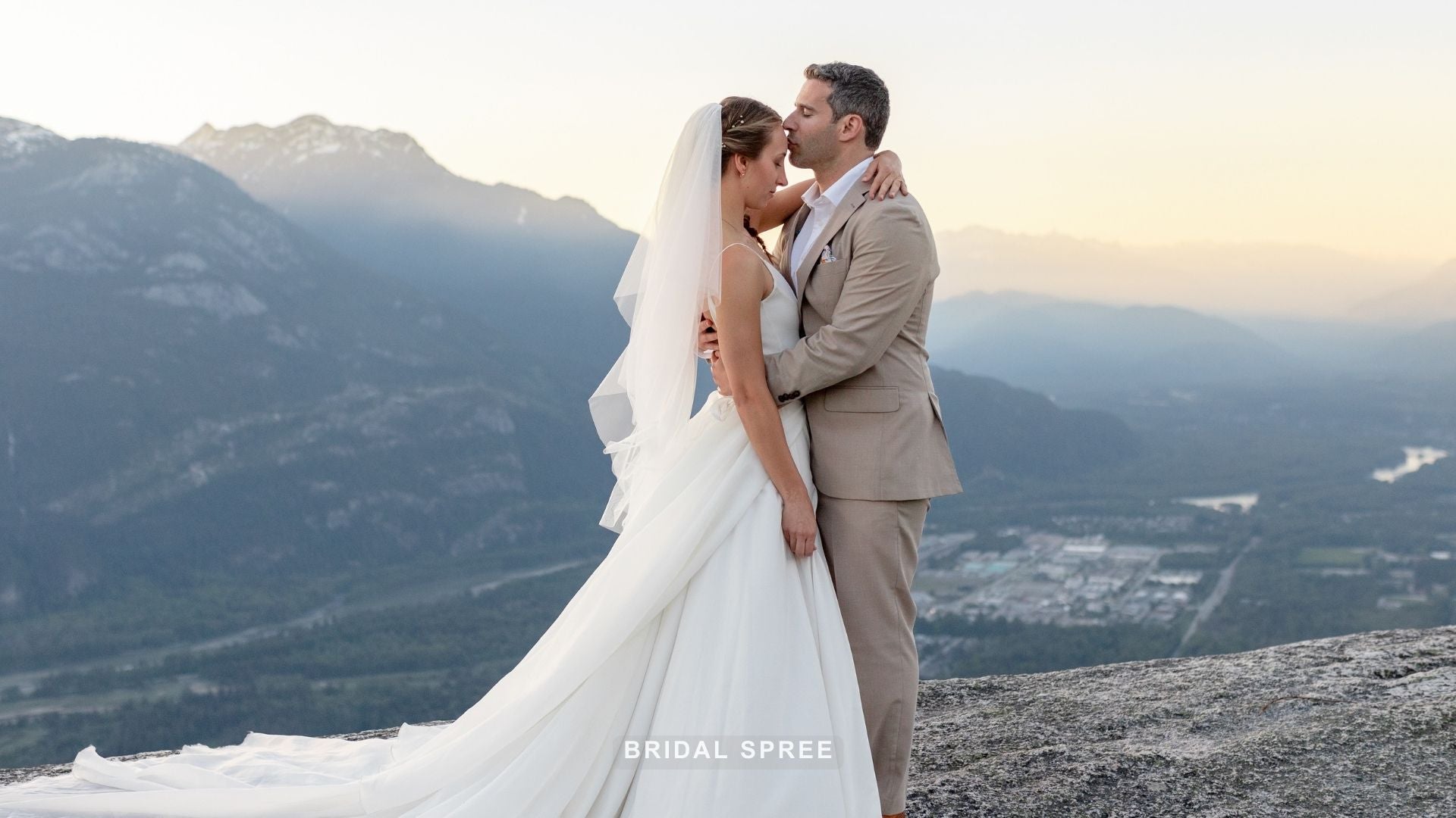 bride wearing two tier fingertip length veil for outdoor mountaintop wedding