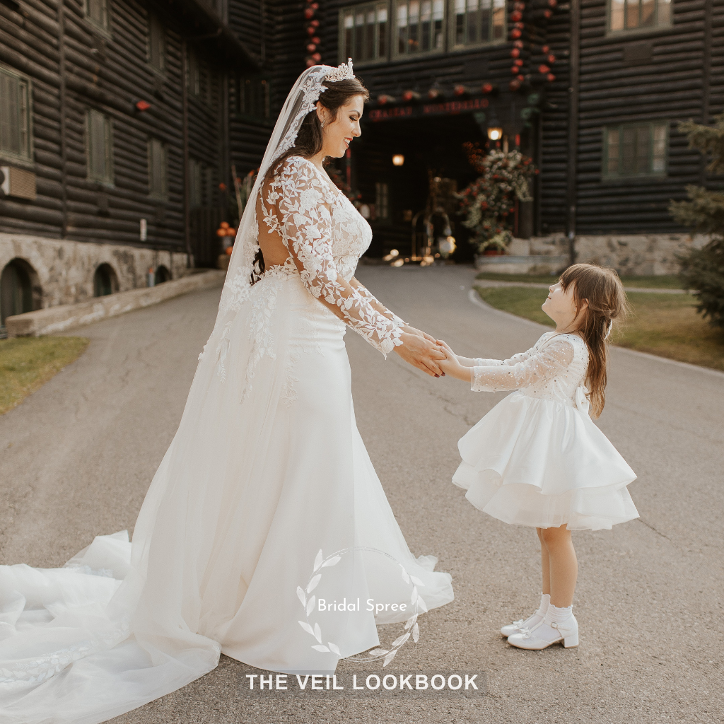 bride wearing lace mantilla veil for outdoor wedding