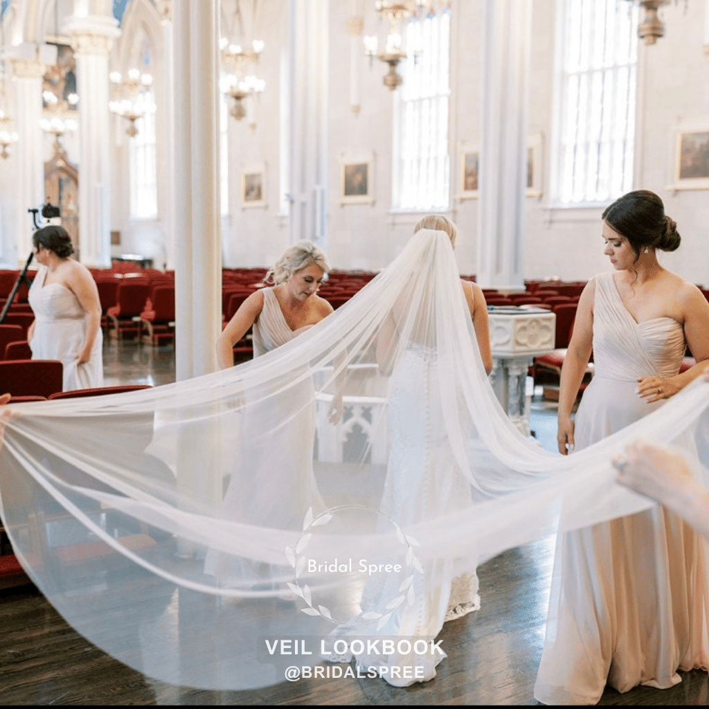 bride wearing cathedral veil for church wedding