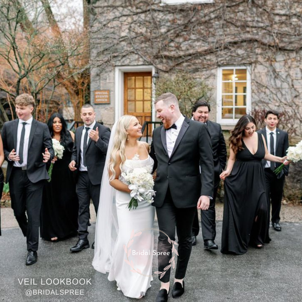 Bride wearing floor length veil for outdoor wedding