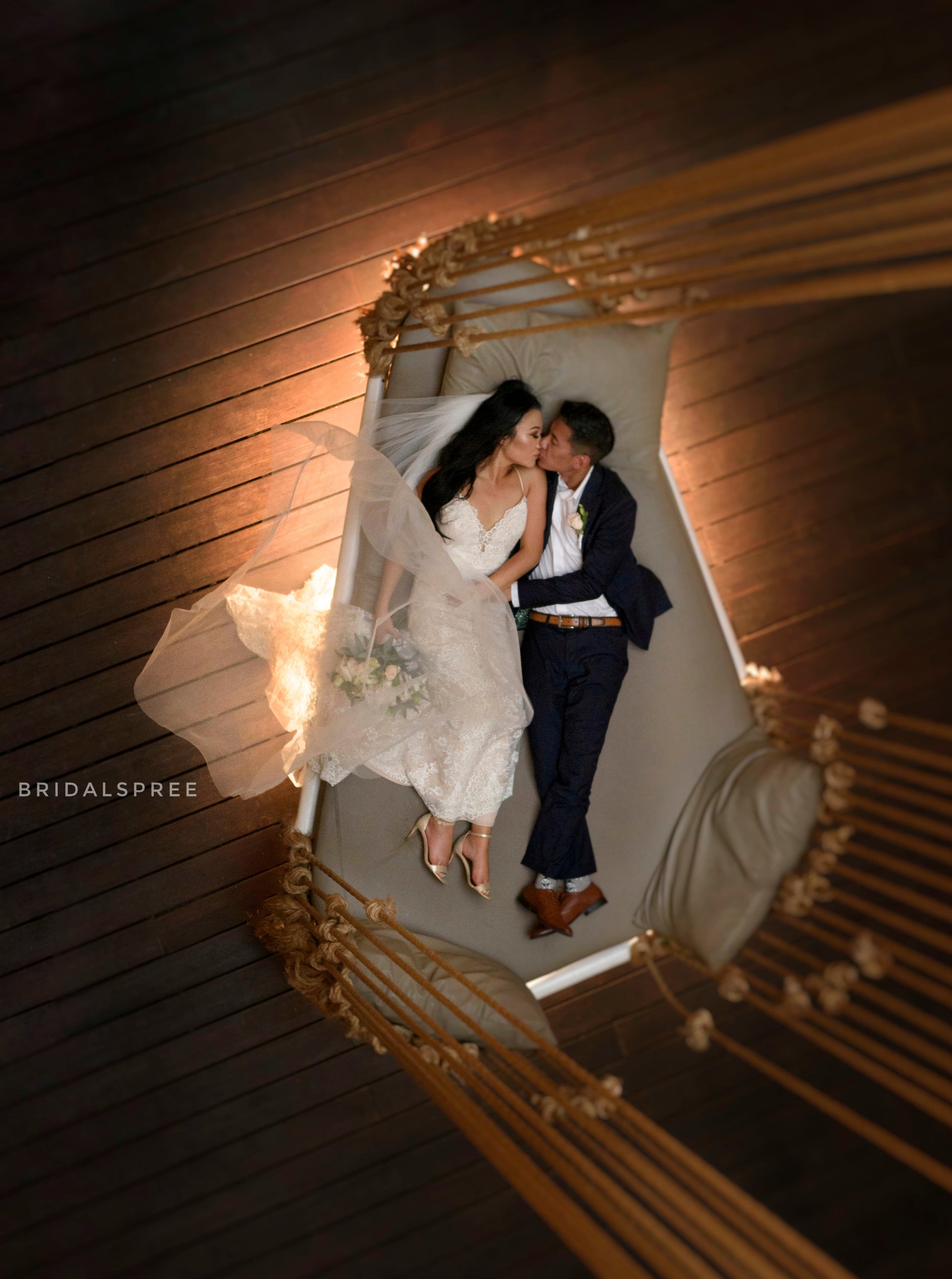 Indoor Studio Wedding Photoshoot of Bride wearing Mermaid wedding dress with floor veil