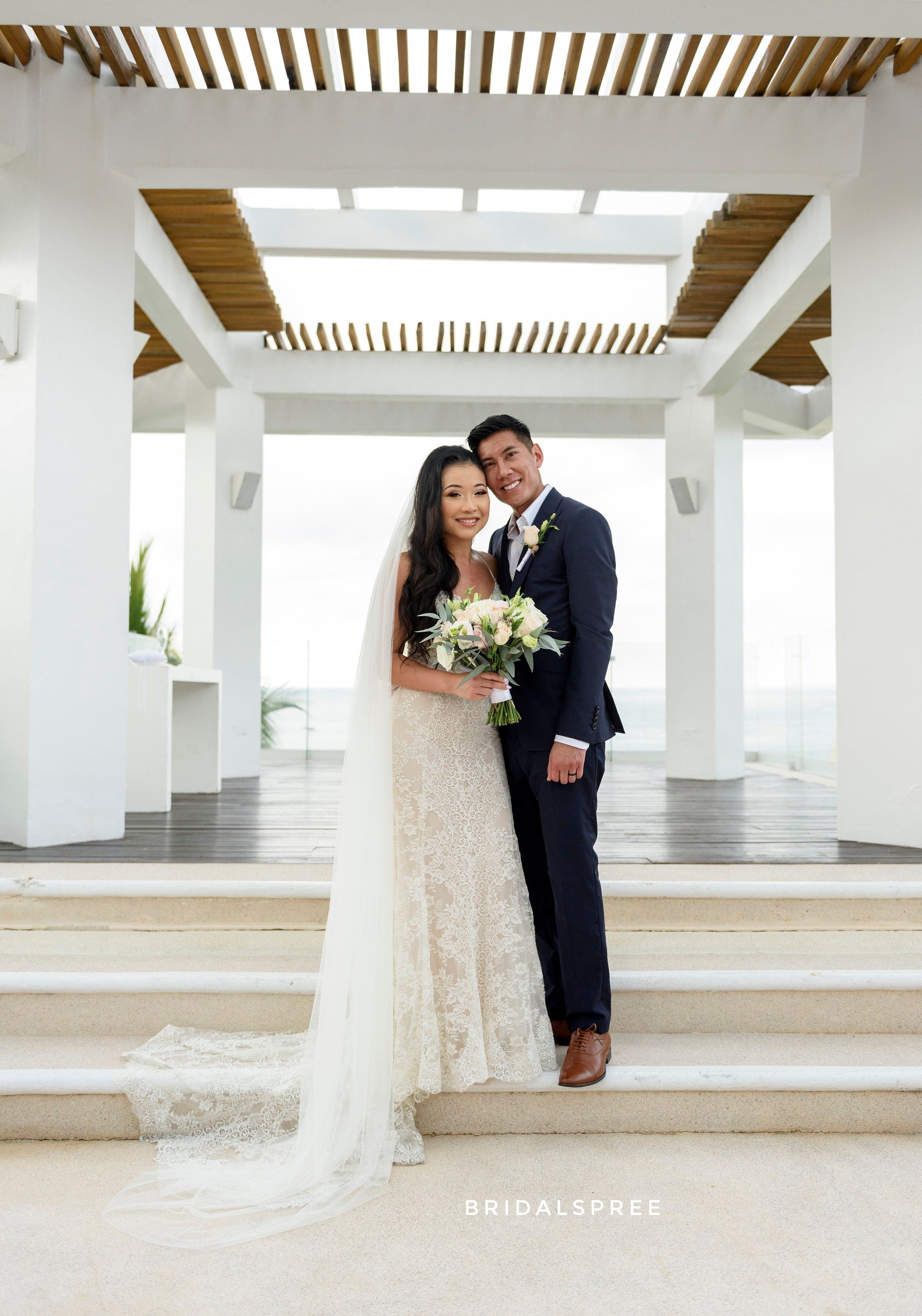 Wedding Veil inspiration of Bride wearing Bridal Spree's luxuriously soft chapel veil for beach wedding and outdoor weddingBride wearing lace mermaid dress with Bridal Spree's white long soft chapel veil
